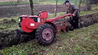 Plowing with a heavy walk-behind tractor