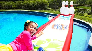 Longest WATER SLIDE Experiment - Last to Knock Down the Bowling Pins Wins at Ellie's Camp