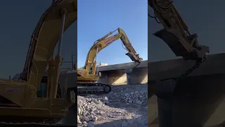 10,000 Pound Wrecking Ball Attached to Excavator