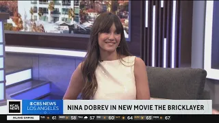 Actress Nina Dobrev talks new film "The Bricklayer"