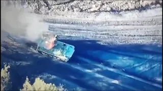 Battle of Avdiivka: Russian crewmen jump out of a moving burning armoured vehicle.