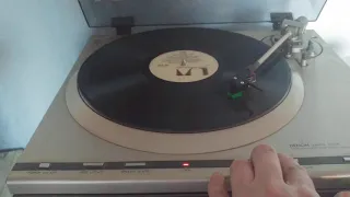 Vinyl Track Selection With A Vintage Turntable