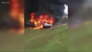 Strangers save elderly woman from burning car moments before it explodes