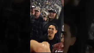Woman Flashes her Boobs.Mother gets mad as her kids saw Boobs. Crowed throws beer on mad mother.