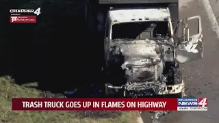 Trash truck goes up in flames on highway