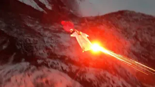 Wingsuit Skydiver Jumps Off Mountain by Night With Flares to Guide Him