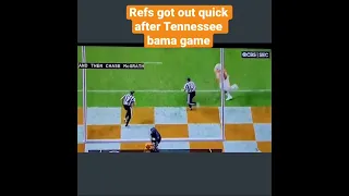 Refs run away before Tennessee fans tear down the goalposts after beating Nick Saban and Alabama