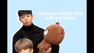 daehyun being cute with a plushie for a minute and forty seconds