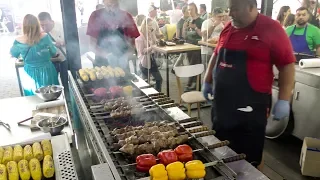 Automatic Machine Grilling Skewers of Pork, Mutton, Veal and Chicken. Kiev Street Food, Ukraine