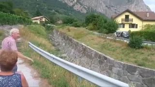 Watch People Stand By As Mudslide Flows Into Swiss Town