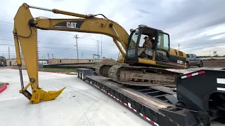 Side loading the 320  Cat excavator on the RGN trailer