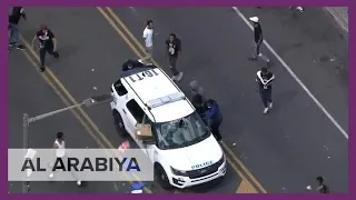 Protesters destroy line of police cars in west Philadelphia