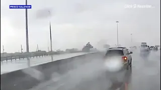 Wild video shows truck falling over overpass after crash