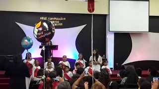 Beautiful kids sing a song for their pastor