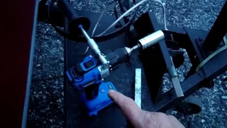 Using a cordless drill to lift the pop-up camper roof