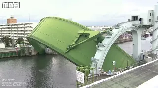 Unique arched floodgates protect from typhoons and storm surges in Osaka, Japan.