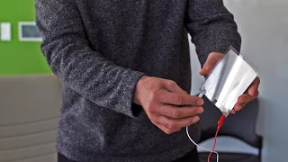 A paper-thin loudspeaker plays "We Are the Champions" by Queen