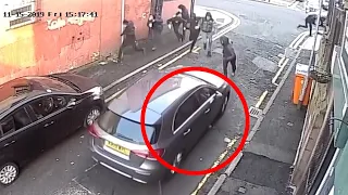 Surveillance Camera Footage Captures Gang Drive-by Shooting In Manchester, England