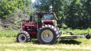 1950 Oliver Cockshutt tractor with 4-53 Detroit Diesel pulling huge log