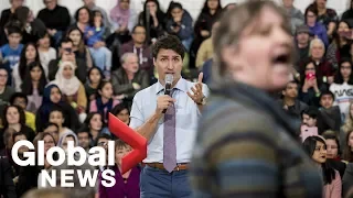 Trudeau gets heated as hecklers interrupt his talk on climate change