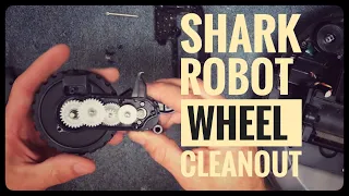 Vacuum Repairman shows how to take apart a Shark Robot vacuum wheel for cleaning