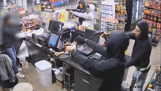 Video shows four armed suspects hold up clerk at gunpoint near NRG Stadium in Houston, Texas