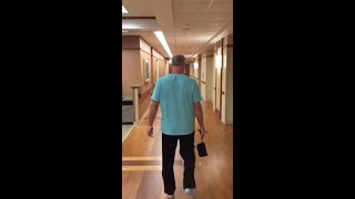 Hip replacement patient walks down the hall two hours after surgery