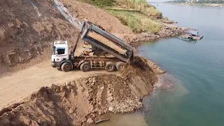 Perfect Bulldozer Dropping Dirt into Water with Dump Truck on Road Construction Best Processing