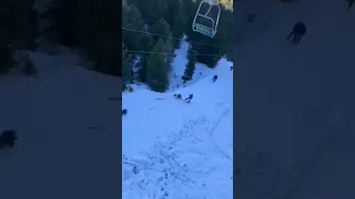 Snowboarder falls and takes down the whole lift