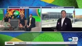 NBC's Jay Gray helps Andrew Wittenberg get in the Olympic spirit