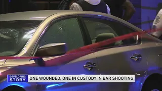 One injured, one in custody in River North bar shooting