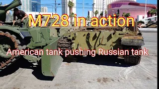 M728 tank in action, pushing Russian tank