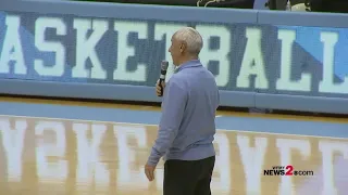 UNC's Roy Williams kissing the Dean Dome floor after the Tar Heels final home game vs. Duke
