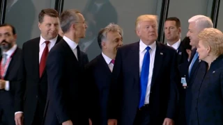 Trump shoves fellow leader