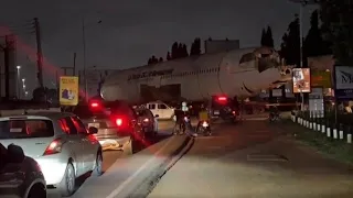 towing car carrying europlane in Accra | how la tante DC 10 restaurant plane was moved