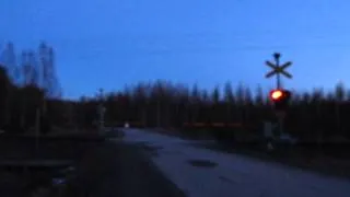 Freight train T 3473 passed SAUVAMÄKI (Km.0427+0052) level crossing in Hankasalmi, Finland