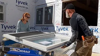 Installing our 6 Foot Casement windows.  DIY Post and Beam home build #122.