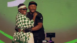 Teni pulls celebrity cameraman Chixon on stage as she performs Power Rangers.