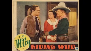 TIM MCCOY IN THE WESTERN CATTLE WAR MOVIE OF "RIDING WILD". FRONTIER JUSTICE.