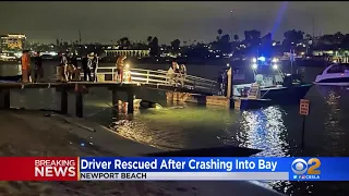 Woman rescued after driving into water in Newport Beach