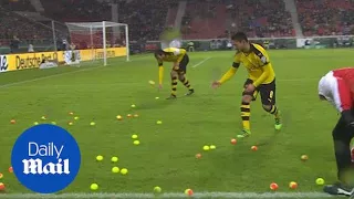 Moment outraged Dortmund fans chuck tennis balls onto pitch - Daily Mail