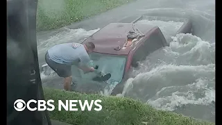 Dramatic video shows Texas couple rescuing truck driver from flooded ditch