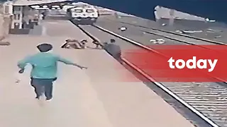 Indian man saves boy from oncoming train