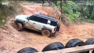 BYD off road SUV climb wet slippery slop in Rainy day.