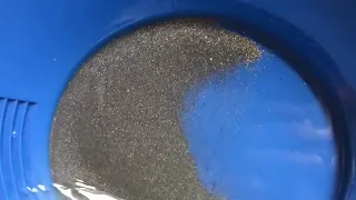 Finding gold in black sand.