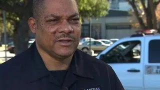 Off-duty L.A. police officer rescues man from burning car