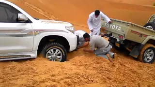 Toyota Land Cruiser stuck in desert sand