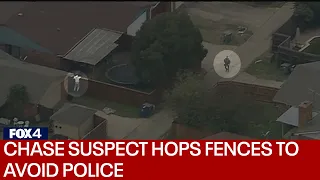 RAW: High speed chase suspect hops fences to try to avoid police