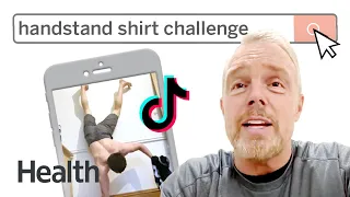 Pro-Trainer Reacts to the Handstand T-Shirt Challenge | Health vs. The Internet | Health