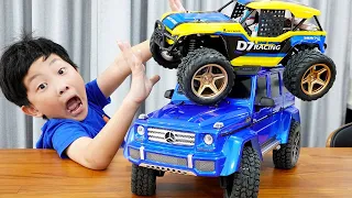 Yejun plays with cars on power wheels and races on playground